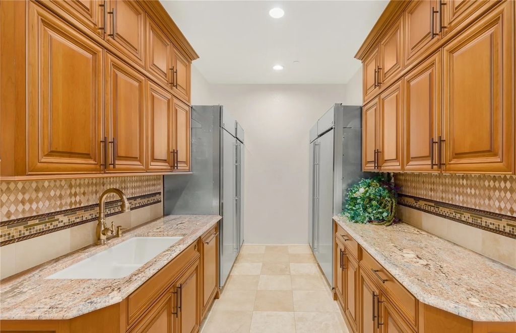 The Estate in Maple Valley boasts striking 22’ ceilings, library, home theater, gym, conference room, and an elevator to all three floors, now available for sale. This home located at 21145 212th Avenue SE, Maple Valley, Washington