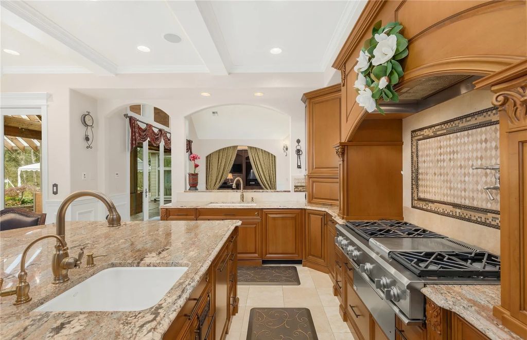 The Estate in Maple Valley boasts striking 22’ ceilings, library, home theater, gym, conference room, and an elevator to all three floors, now available for sale. This home located at 21145 212th Avenue SE, Maple Valley, Washington