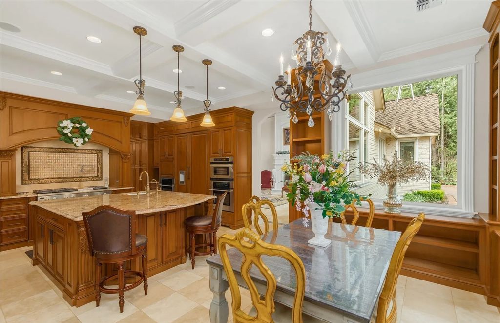 The Estate in Maple Valley boasts striking 22’ ceilings, library, home theater, gym, conference room, and an elevator to all three floors, now available for sale. This home located at 21145 212th Avenue SE, Maple Valley, Washington