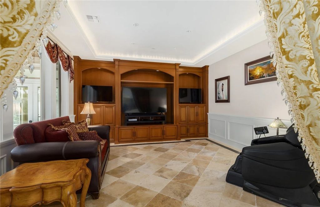 The Estate in Maple Valley boasts striking 22’ ceilings, library, home theater, gym, conference room, and an elevator to all three floors, now available for sale. This home located at 21145 212th Avenue SE, Maple Valley, Washington