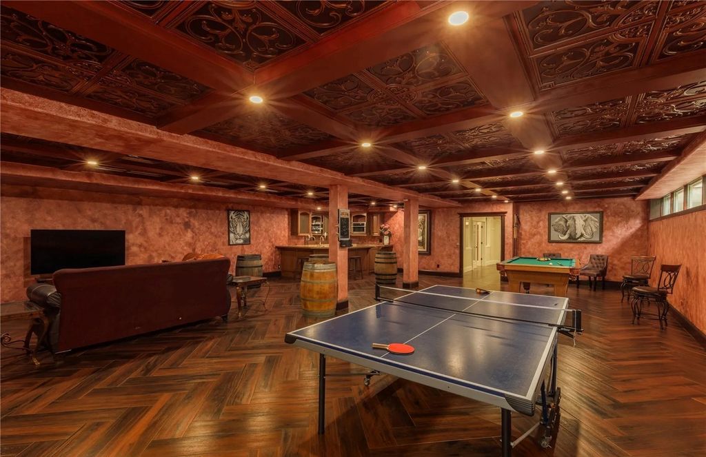 The Estate in Maple Valley boasts striking 22’ ceilings, library, home theater, gym, conference room, and an elevator to all three floors, now available for sale. This home located at 21145 212th Avenue SE, Maple Valley, Washington