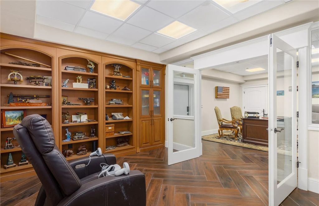 The Estate in Maple Valley boasts striking 22’ ceilings, library, home theater, gym, conference room, and an elevator to all three floors, now available for sale. This home located at 21145 212th Avenue SE, Maple Valley, Washington