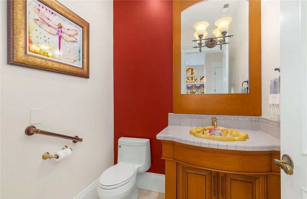 The Estate in Maple Valley boasts striking 22’ ceilings, library, home theater, gym, conference room, and an elevator to all three floors, now available for sale. This home located at 21145 212th Avenue SE, Maple Valley, Washington
