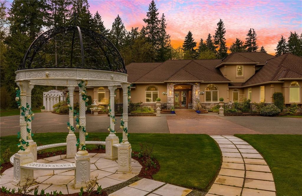 The Estate in Maple Valley boasts striking 22’ ceilings, library, home theater, gym, conference room, and an elevator to all three floors, now available for sale. This home located at 21145 212th Avenue SE, Maple Valley, Washington