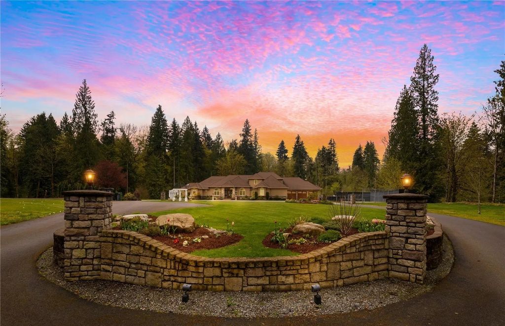 The Estate in Maple Valley boasts striking 22’ ceilings, library, home theater, gym, conference room, and an elevator to all three floors, now available for sale. This home located at 21145 212th Avenue SE, Maple Valley, Washington