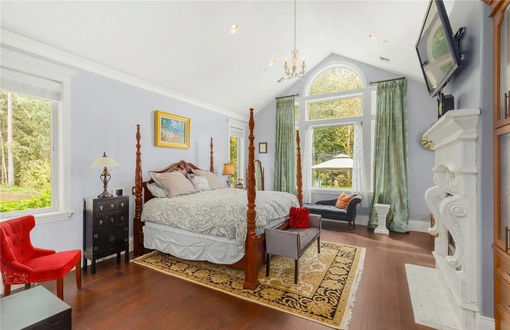 The Estate in Maple Valley boasts striking 22’ ceilings, library, home theater, gym, conference room, and an elevator to all three floors, now available for sale. This home located at 21145 212th Avenue SE, Maple Valley, Washington