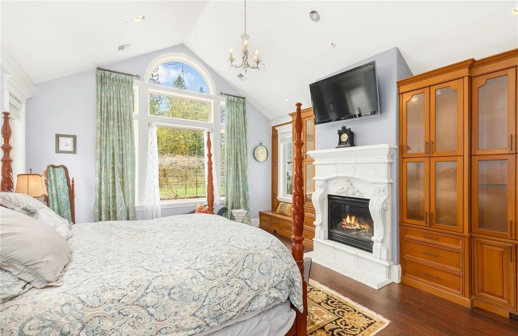 The Estate in Maple Valley boasts striking 22’ ceilings, library, home theater, gym, conference room, and an elevator to all three floors, now available for sale. This home located at 21145 212th Avenue SE, Maple Valley, Washington