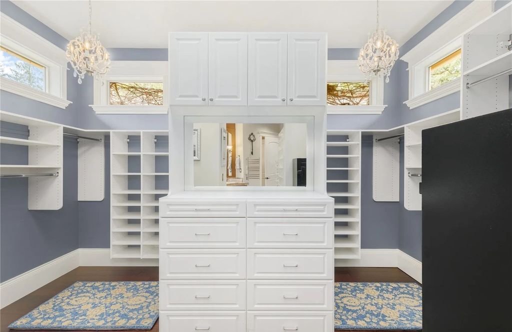 The Estate in Maple Valley boasts striking 22’ ceilings, library, home theater, gym, conference room, and an elevator to all three floors, now available for sale. This home located at 21145 212th Avenue SE, Maple Valley, Washington