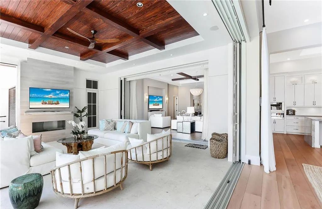 450 14th Ave South, Naples, Florida is a showcase of timeless sophistication with an Olde Florida twist and designer touches throughout near with superb dining and shopping options and a stone’s throw from the powder-soft sandy beach and tranquil Gulf waters.