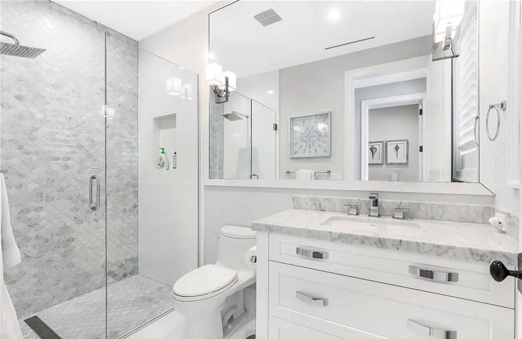450 14th Ave South, Naples, Florida is a showcase of timeless sophistication with an Olde Florida twist and designer touches throughout near with superb dining and shopping options and a stone’s throw from the powder-soft sandy beach and tranquil Gulf waters.