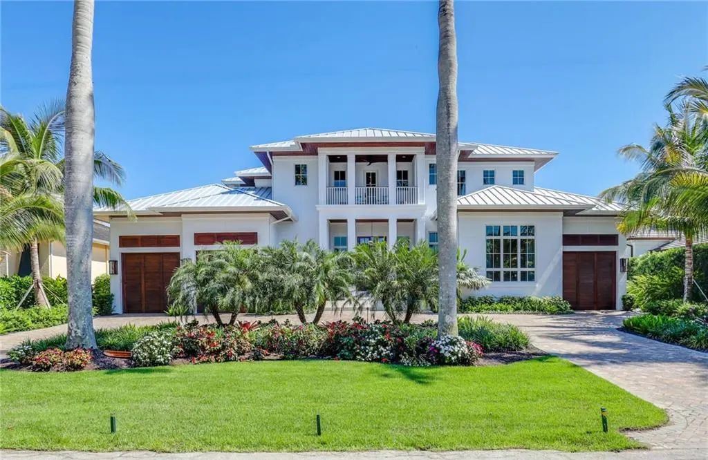 450 14th Ave South, Naples, Florida is a showcase of timeless sophistication with an Olde Florida twist and designer touches throughout near with superb dining and shopping options and a stone’s throw from the powder-soft sandy beach and tranquil Gulf waters.