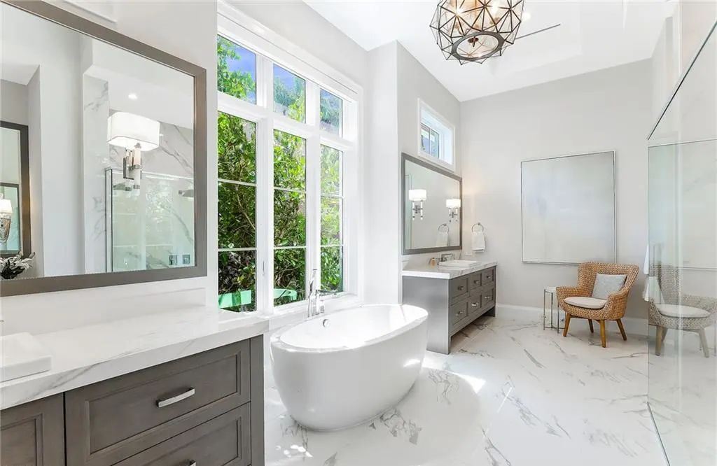 450 14th Ave South, Naples, Florida is a showcase of timeless sophistication with an Olde Florida twist and designer touches throughout near with superb dining and shopping options and a stone’s throw from the powder-soft sandy beach and tranquil Gulf waters.