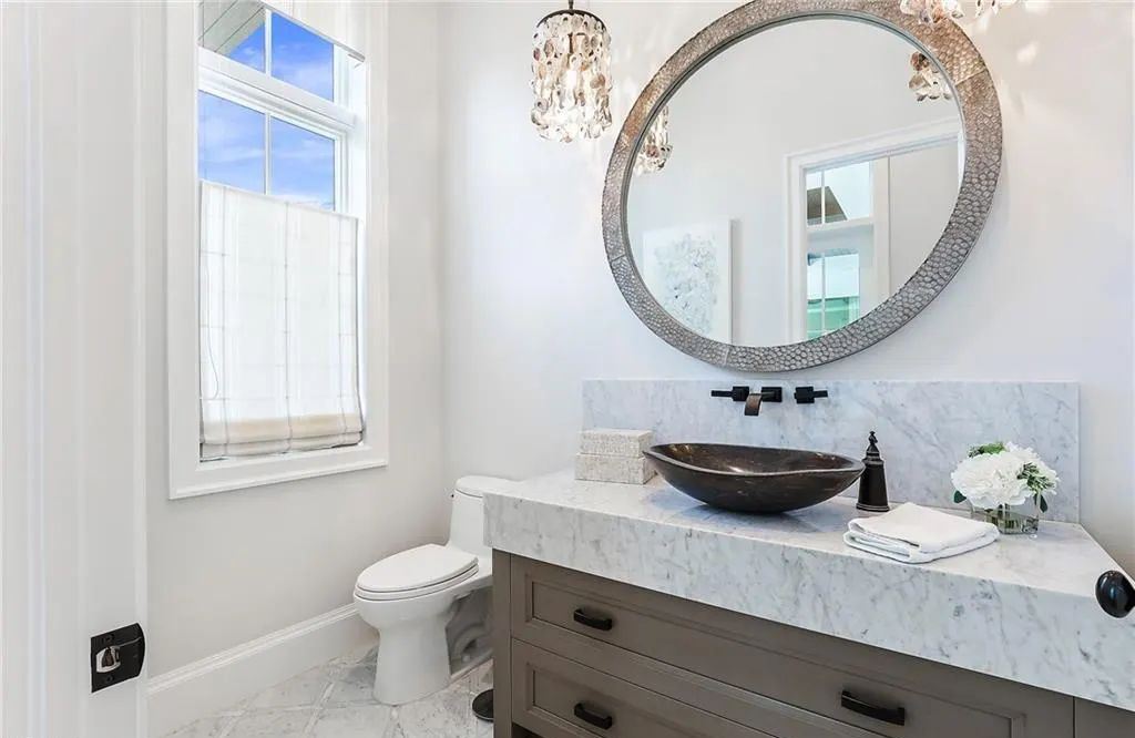 450 14th Ave South, Naples, Florida is a showcase of timeless sophistication with an Olde Florida twist and designer touches throughout near with superb dining and shopping options and a stone’s throw from the powder-soft sandy beach and tranquil Gulf waters.