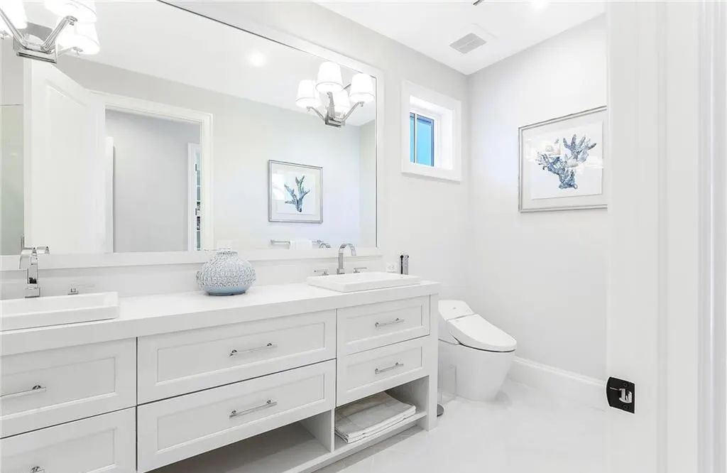 450 14th Ave South, Naples, Florida is a showcase of timeless sophistication with an Olde Florida twist and designer touches throughout near with superb dining and shopping options and a stone’s throw from the powder-soft sandy beach and tranquil Gulf waters.