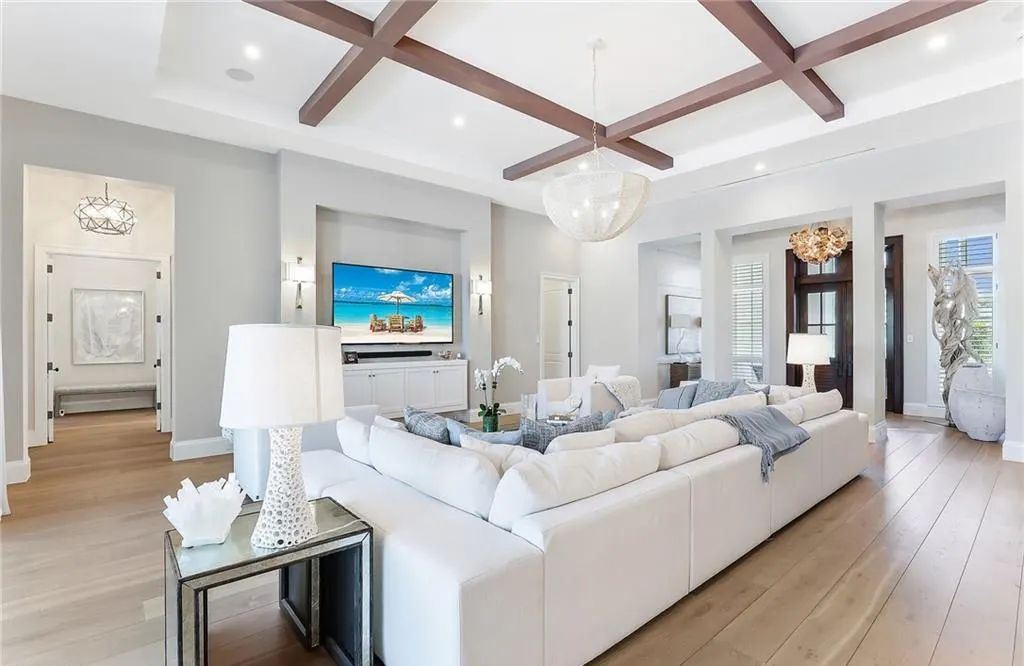 450 14th Ave South, Naples, Florida is a showcase of timeless sophistication with an Olde Florida twist and designer touches throughout near with superb dining and shopping options and a stone’s throw from the powder-soft sandy beach and tranquil Gulf waters.