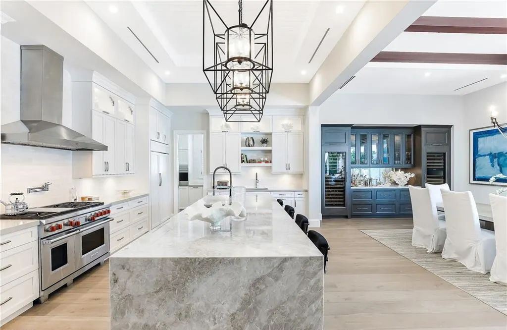 450 14th Ave South, Naples, Florida is a showcase of timeless sophistication with an Olde Florida twist and designer touches throughout near with superb dining and shopping options and a stone’s throw from the powder-soft sandy beach and tranquil Gulf waters.