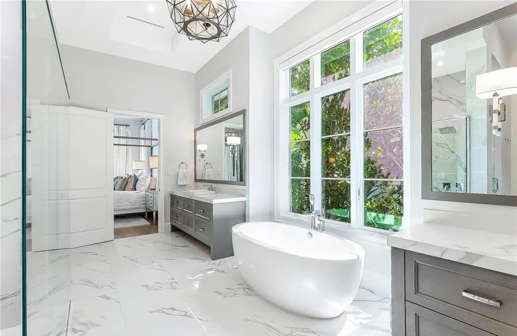 450 14th Ave South, Naples, Florida is a showcase of timeless sophistication with an Olde Florida twist and designer touches throughout near with superb dining and shopping options and a stone’s throw from the powder-soft sandy beach and tranquil Gulf waters.