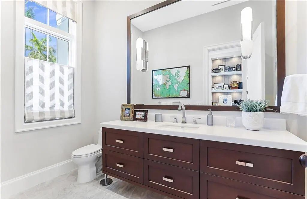 450 14th Ave South, Naples, Florida is a showcase of timeless sophistication with an Olde Florida twist and designer touches throughout near with superb dining and shopping options and a stone’s throw from the powder-soft sandy beach and tranquil Gulf waters.