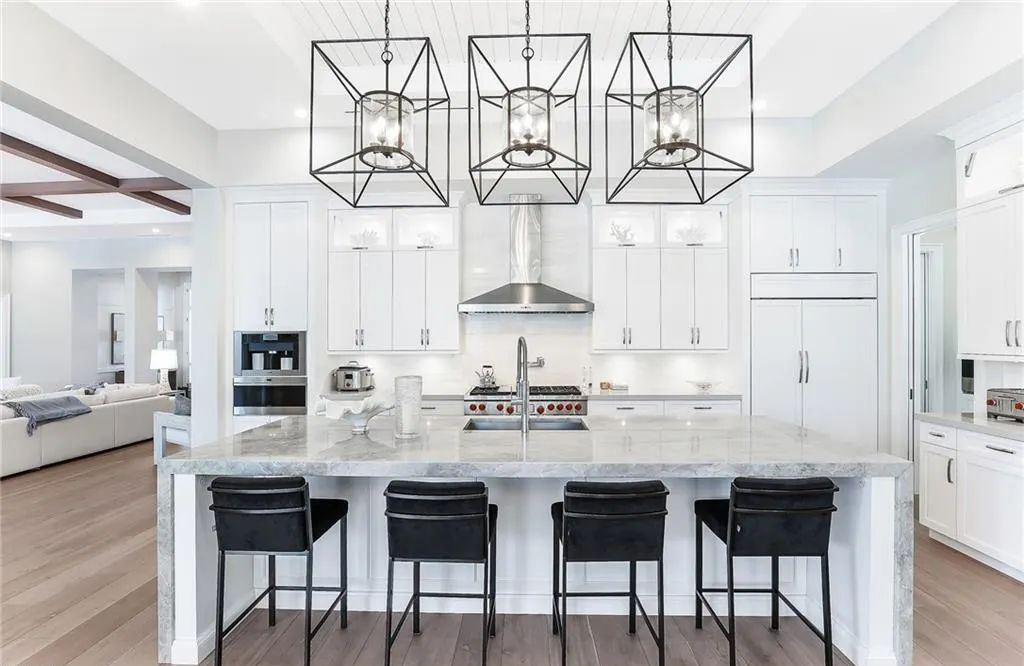 450 14th Ave South, Naples, Florida is a showcase of timeless sophistication with an Olde Florida twist and designer touches throughout near with superb dining and shopping options and a stone’s throw from the powder-soft sandy beach and tranquil Gulf waters.