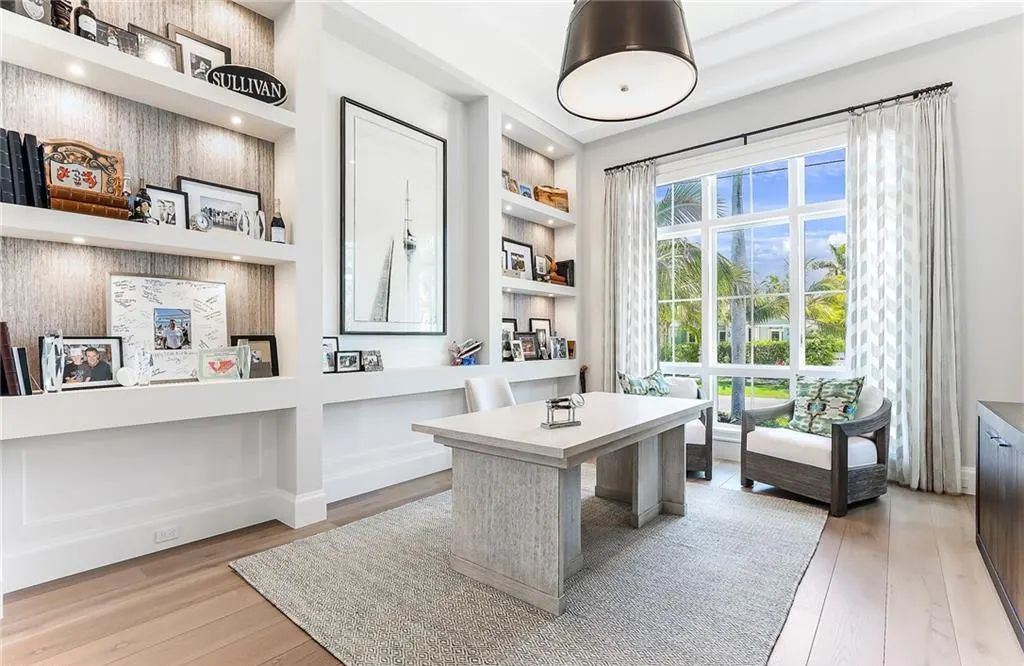 450 14th Ave South, Naples, Florida is a showcase of timeless sophistication with an Olde Florida twist and designer touches throughout near with superb dining and shopping options and a stone’s throw from the powder-soft sandy beach and tranquil Gulf waters.