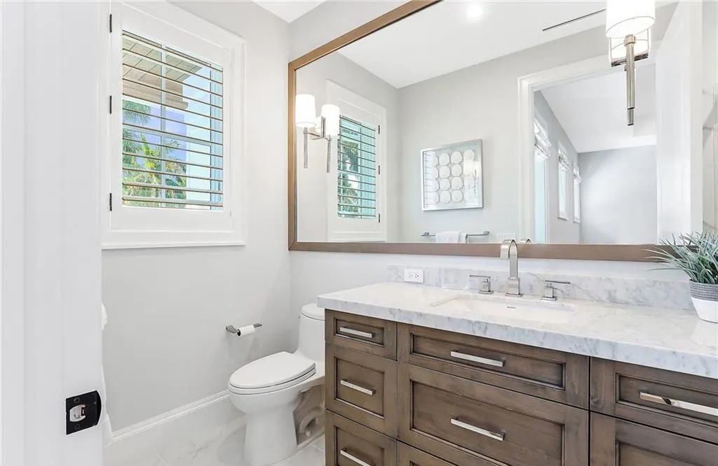 450 14th Ave South, Naples, Florida is a showcase of timeless sophistication with an Olde Florida twist and designer touches throughout near with superb dining and shopping options and a stone’s throw from the powder-soft sandy beach and tranquil Gulf waters.