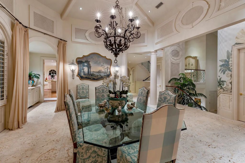 16440 Gulf Shores Drive, Boca Grande, Florida is a breathtaking home sit on unparalleled location offering privacy and luxurious coastal living with lush tropical landscaping and inviting outdoor spaces, boasting incredible views of the Gulf on one side and Lake Gasparilla on the other.