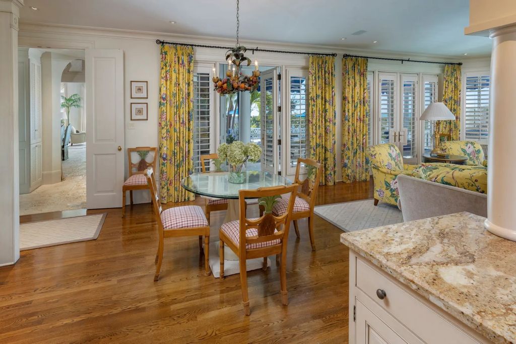 16440 Gulf Shores Drive, Boca Grande, Florida is a breathtaking home sit on unparalleled location offering privacy and luxurious coastal living with lush tropical landscaping and inviting outdoor spaces, boasting incredible views of the Gulf on one side and Lake Gasparilla on the other.