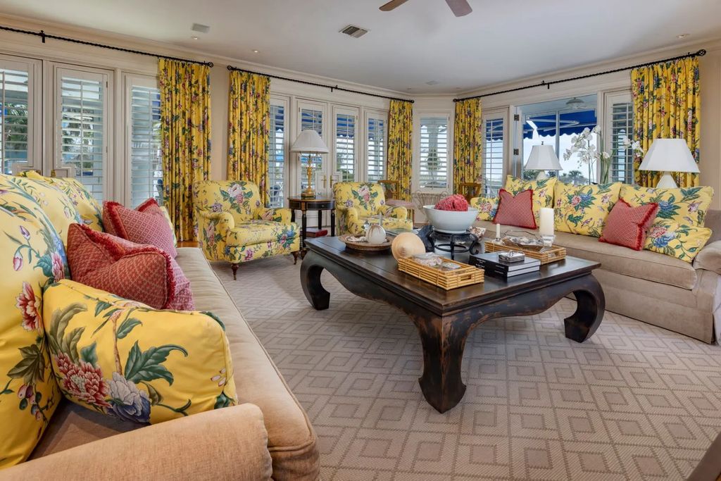 16440 Gulf Shores Drive, Boca Grande, Florida is a breathtaking home sit on unparalleled location offering privacy and luxurious coastal living with lush tropical landscaping and inviting outdoor spaces, boasting incredible views of the Gulf on one side and Lake Gasparilla on the other.