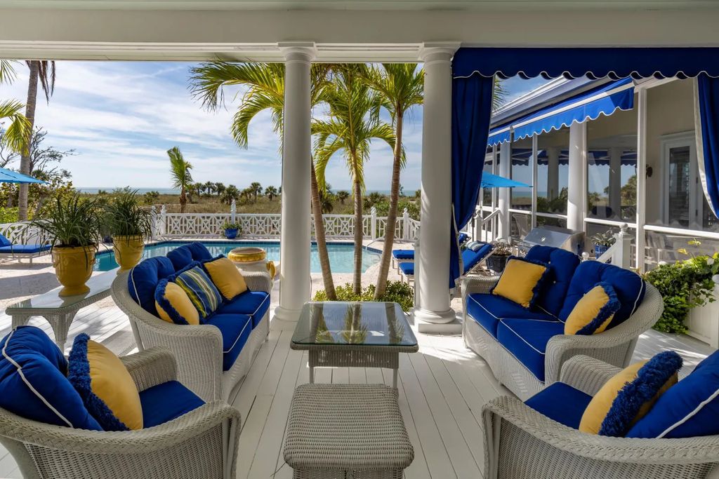 16440 Gulf Shores Drive, Boca Grande, Florida is a breathtaking home sit on unparalleled location offering privacy and luxurious coastal living with lush tropical landscaping and inviting outdoor spaces, boasting incredible views of the Gulf on one side and Lake Gasparilla on the other.