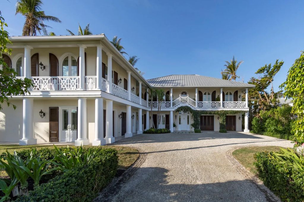 16440 Gulf Shores Drive, Boca Grande, Florida is a breathtaking home sit on unparalleled location offering privacy and luxurious coastal living with lush tropical landscaping and inviting outdoor spaces, boasting incredible views of the Gulf on one side and Lake Gasparilla on the other.