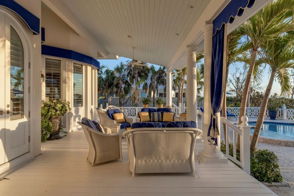 16440 Gulf Shores Drive, Boca Grande, Florida is a breathtaking home sit on unparalleled location offering privacy and luxurious coastal living with lush tropical landscaping and inviting outdoor spaces, boasting incredible views of the Gulf on one side and Lake Gasparilla on the other.