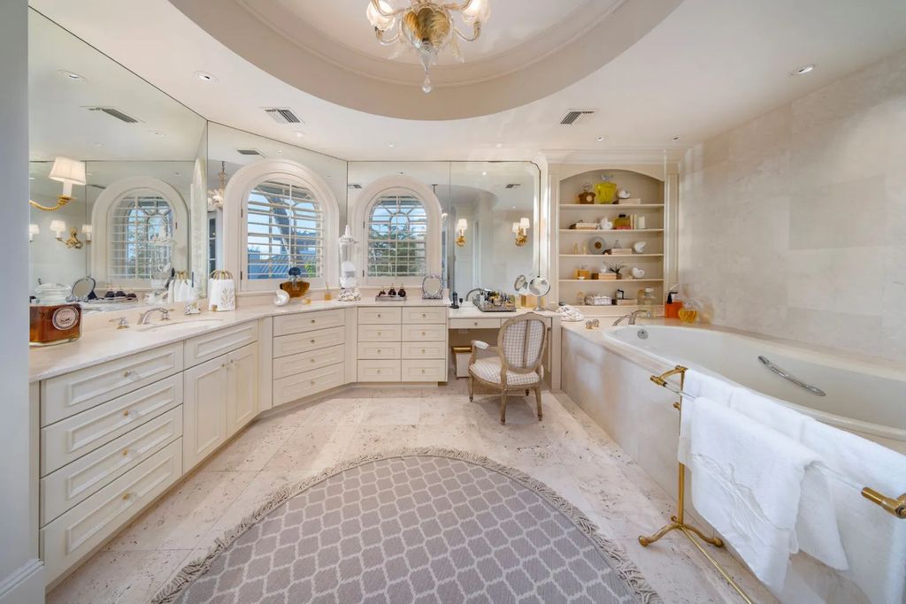 16440 Gulf Shores Drive, Boca Grande, Florida is a breathtaking home sit on unparalleled location offering privacy and luxurious coastal living with lush tropical landscaping and inviting outdoor spaces, boasting incredible views of the Gulf on one side and Lake Gasparilla on the other.