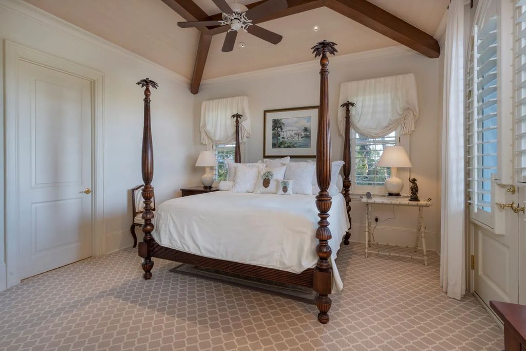 16440 Gulf Shores Drive, Boca Grande, Florida is a breathtaking home sit on unparalleled location offering privacy and luxurious coastal living with lush tropical landscaping and inviting outdoor spaces, boasting incredible views of the Gulf on one side and Lake Gasparilla on the other.