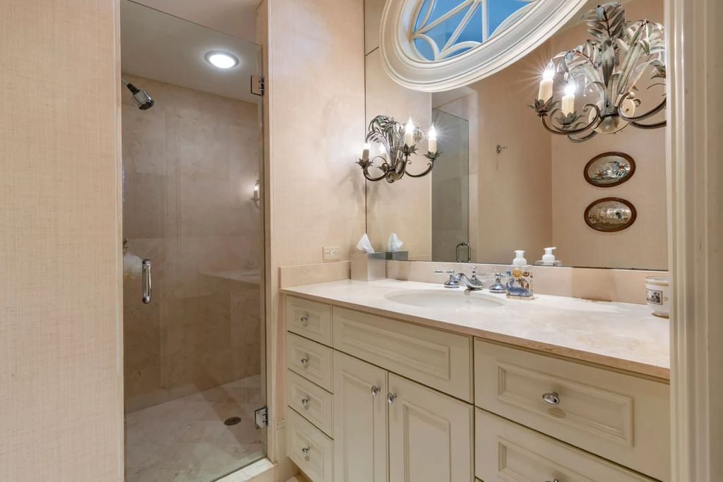 16440 Gulf Shores Drive, Boca Grande, Florida is a breathtaking home sit on unparalleled location offering privacy and luxurious coastal living with lush tropical landscaping and inviting outdoor spaces, boasting incredible views of the Gulf on one side and Lake Gasparilla on the other.