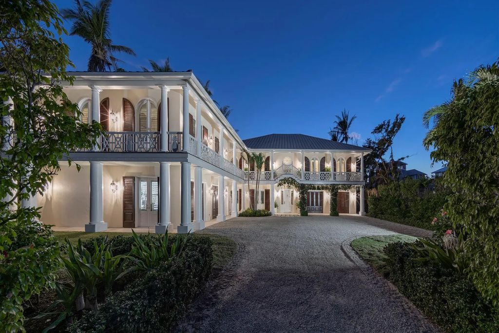 16440 Gulf Shores Drive, Boca Grande, Florida is a breathtaking home sit on unparalleled location offering privacy and luxurious coastal living with lush tropical landscaping and inviting outdoor spaces, boasting incredible views of the Gulf on one side and Lake Gasparilla on the other.