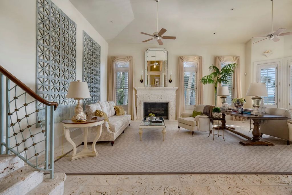 16440 Gulf Shores Drive, Boca Grande, Florida is a breathtaking home sit on unparalleled location offering privacy and luxurious coastal living with lush tropical landscaping and inviting outdoor spaces, boasting incredible views of the Gulf on one side and Lake Gasparilla on the other.