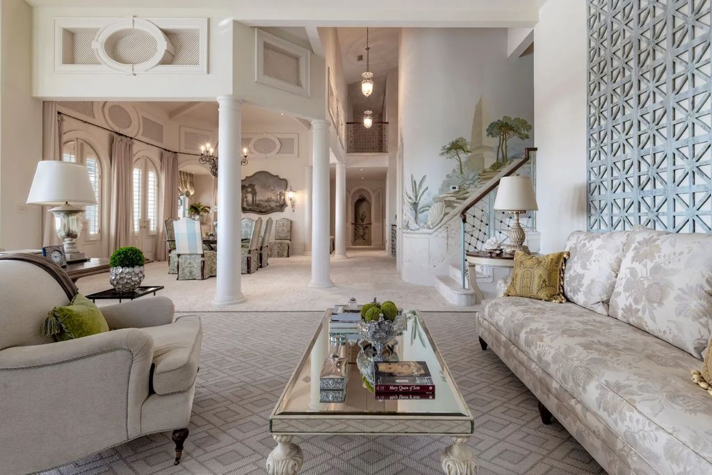 16440 Gulf Shores Drive, Boca Grande, Florida is a breathtaking home sit on unparalleled location offering privacy and luxurious coastal living with lush tropical landscaping and inviting outdoor spaces, boasting incredible views of the Gulf on one side and Lake Gasparilla on the other.