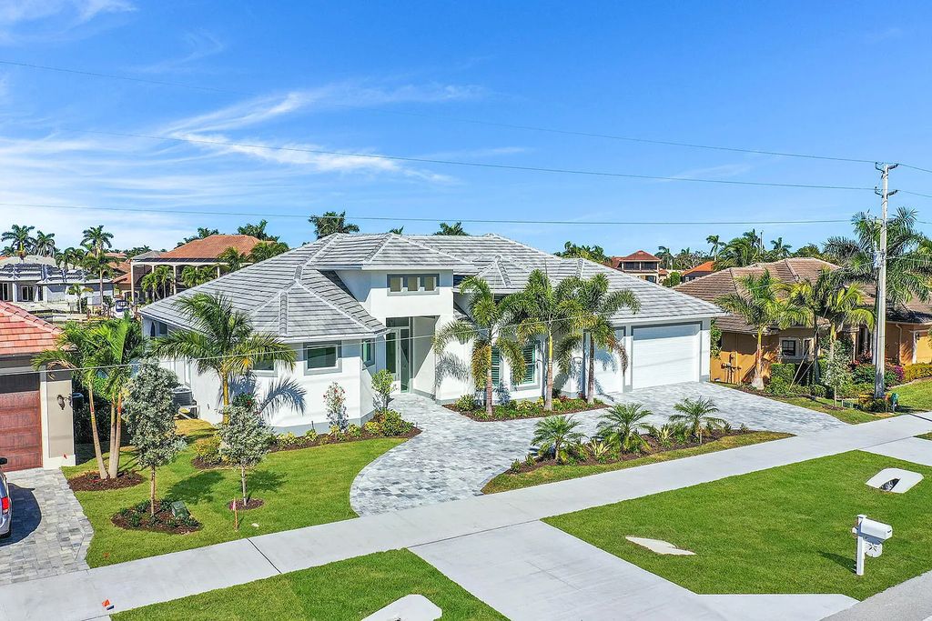 1964 San Marco Road, Marco Island, Florida is a stunning brand-new custom-built luxury coastal-contemporary residence tastefully decorated with high quality furnishings, ultra-custom features with high-end finishes and upgrades.