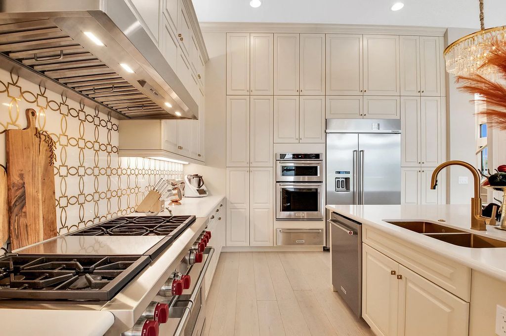 9016 Chauvet Way, Boca Raton, Florida, is built in the highly desired community of Boca Bridges and has more than 5000 square feet. This home is beautifully appointed with custom window treatments, stunning chandeliers, high-end furnishings and glamorous decor throughout.