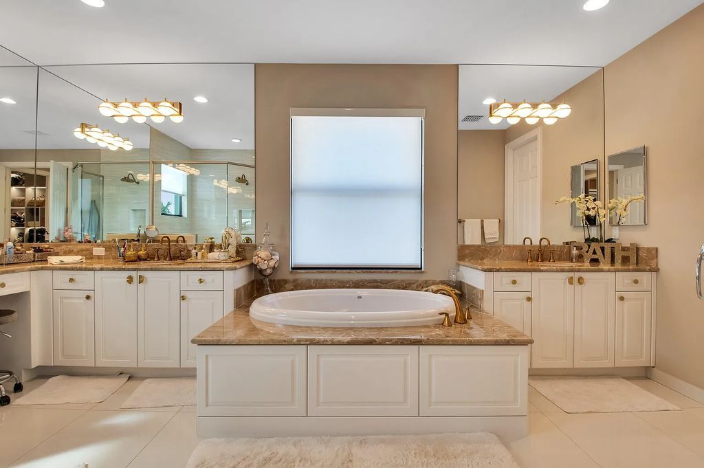 9016 Chauvet Way, Boca Raton, Florida, is built in the highly desired community of Boca Bridges and has more than 5000 square feet. This home is beautifully appointed with custom window treatments, stunning chandeliers, high-end furnishings and glamorous decor throughout.