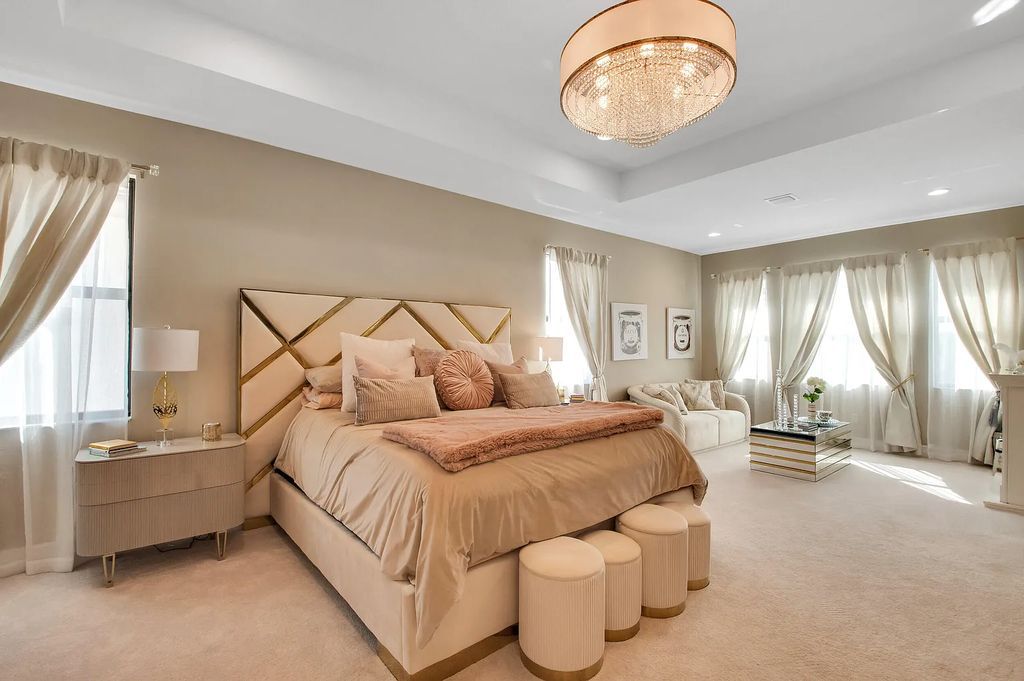 9016 Chauvet Way, Boca Raton, Florida, is built in the highly desired community of Boca Bridges and has more than 5000 square feet. This home is beautifully appointed with custom window treatments, stunning chandeliers, high-end furnishings and glamorous decor throughout.