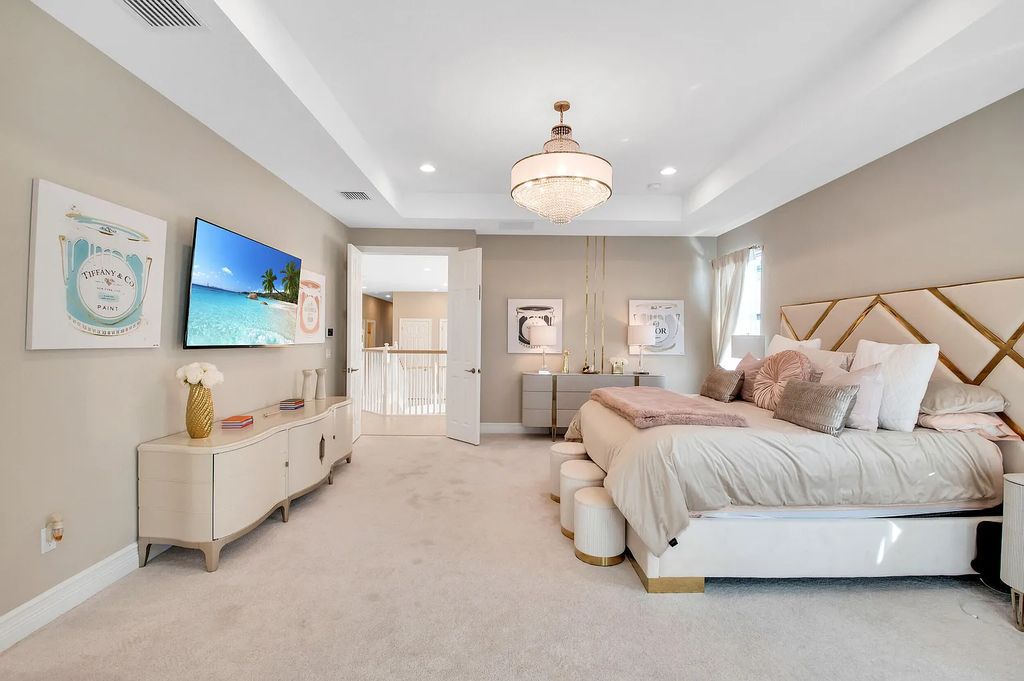 9016 Chauvet Way, Boca Raton, Florida, is built in the highly desired community of Boca Bridges and has more than 5000 square feet. This home is beautifully appointed with custom window treatments, stunning chandeliers, high-end furnishings and glamorous decor throughout.