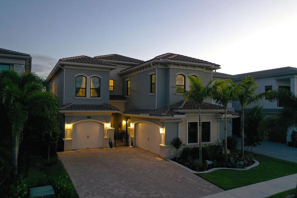 9016 Chauvet Way, Boca Raton, Florida, is built in the highly desired community of Boca Bridges and has more than 5000 square feet. This home is beautifully appointed with custom window treatments, stunning chandeliers, high-end furnishings and glamorous decor throughout.