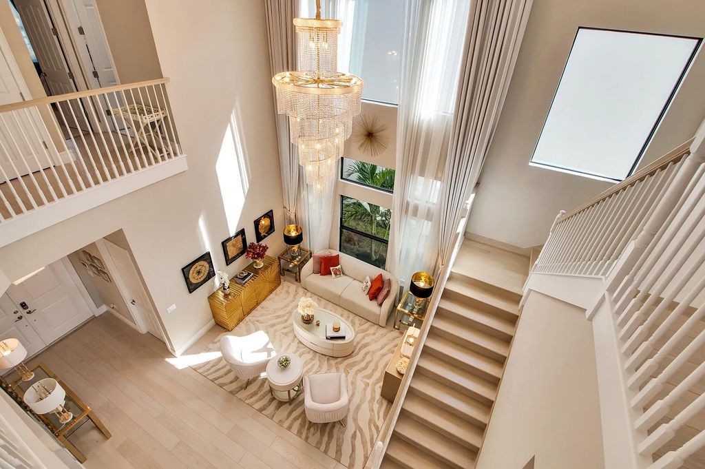 9016 Chauvet Way, Boca Raton, Florida, is built in the highly desired community of Boca Bridges and has more than 5000 square feet. This home is beautifully appointed with custom window treatments, stunning chandeliers, high-end furnishings and glamorous decor throughout.