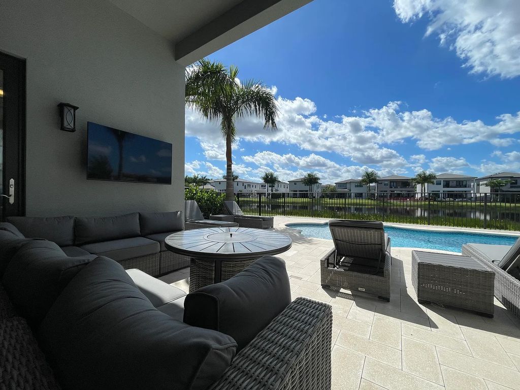 9016 Chauvet Way, Boca Raton, Florida, is built in the highly desired community of Boca Bridges and has more than 5000 square feet. This home is beautifully appointed with custom window treatments, stunning chandeliers, high-end furnishings and glamorous decor throughout.