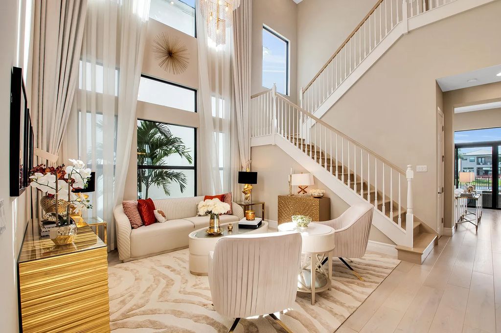 9016 Chauvet Way, Boca Raton, Florida, is built in the highly desired community of Boca Bridges and has more than 5000 square feet. This home is beautifully appointed with custom window treatments, stunning chandeliers, high-end furnishings and glamorous decor throughout.