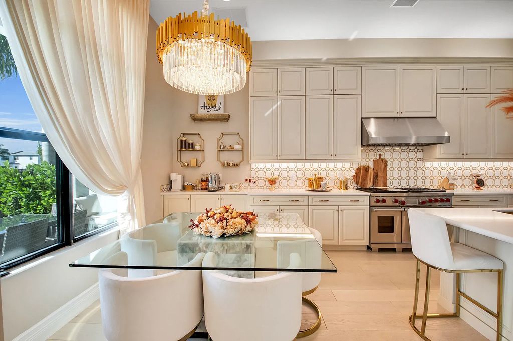 9016 Chauvet Way, Boca Raton, Florida, is built in the highly desired community of Boca Bridges and has more than 5000 square feet. This home is beautifully appointed with custom window treatments, stunning chandeliers, high-end furnishings and glamorous decor throughout.