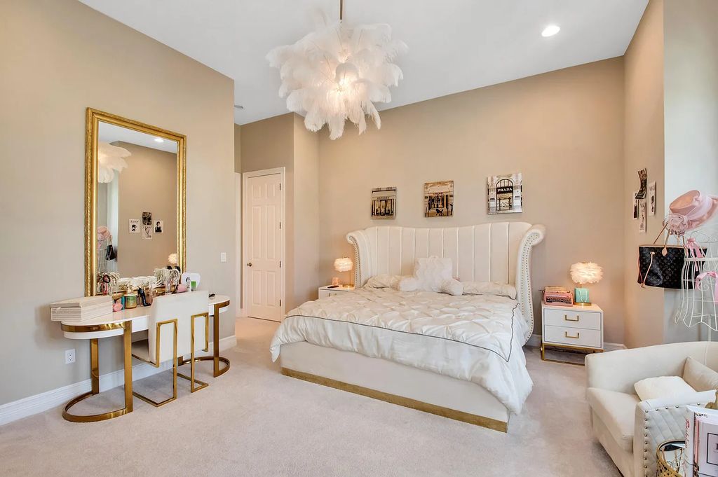 9016 Chauvet Way, Boca Raton, Florida, is built in the highly desired community of Boca Bridges and has more than 5000 square feet. This home is beautifully appointed with custom window treatments, stunning chandeliers, high-end furnishings and glamorous decor throughout.