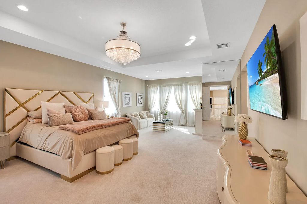 9016 Chauvet Way, Boca Raton, Florida, is built in the highly desired community of Boca Bridges and has more than 5000 square feet. This home is beautifully appointed with custom window treatments, stunning chandeliers, high-end furnishings and glamorous decor throughout.