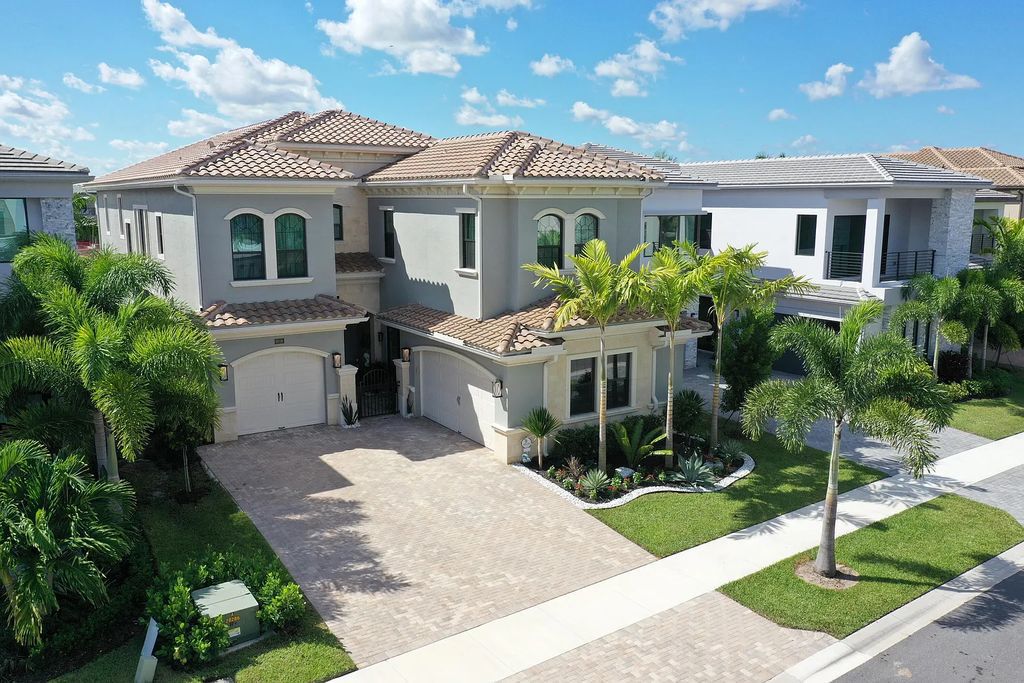 9016 Chauvet Way, Boca Raton, Florida, is built in the highly desired community of Boca Bridges and has more than 5000 square feet. This home is beautifully appointed with custom window treatments, stunning chandeliers, high-end furnishings and glamorous decor throughout.